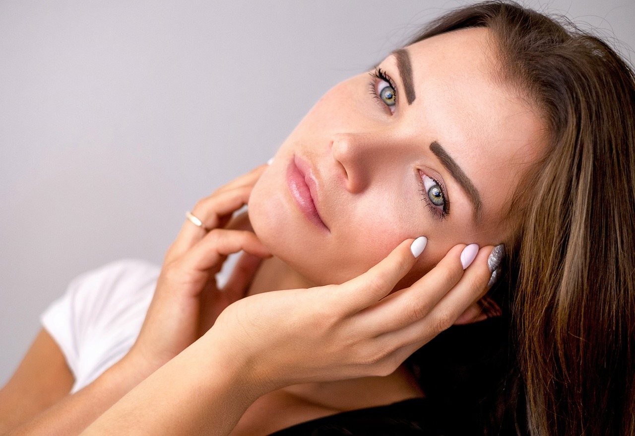 Beautiful woman with a natural, minimal makeup look radiating simplicity and elegance